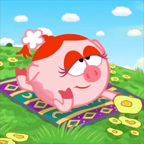 Нюша нюхает цветок